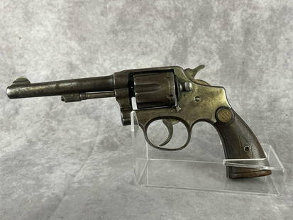 Orbea Hermanos 38 Special Revolver: Serial number 58317. 1922 USA Model. Heavy patina to nickel. Original grips. Barrel measures 4.5 inches long. Gun measures 11 inches. Includes leather holster.