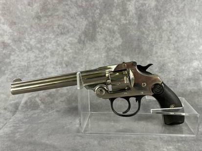 US Revolver Co. 32 Double Action Revolver: Serial number 15881, top break seven shot revolver with original grips. In good condition, clean barrel and cylinder. Barrel measures 5 inches, gun measures 8 inches long.