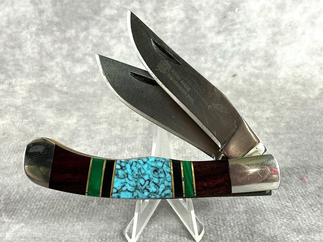 Glen Yellowhorse Knife: Two blade pocket knife with desert wood and turquoise inlay. Email printed, includes an informal COA, from David Yellowhorse stating this was made by Glen Yellowhorse between the years of 1995 to 1997