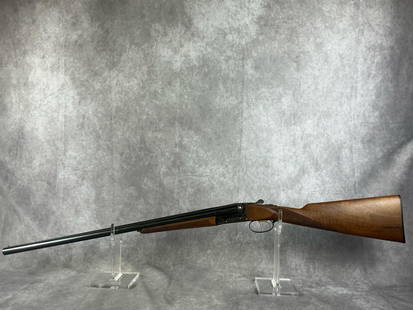 P. Bernardelli SXS 20 GA Shotgun: Serial number 03683. P. Bernardelli side by side double barrel shotgun. Beautiful walnut stock, golden double triggers, full scroll engraved receiver. Very good condition, almost mint. Barrel measures