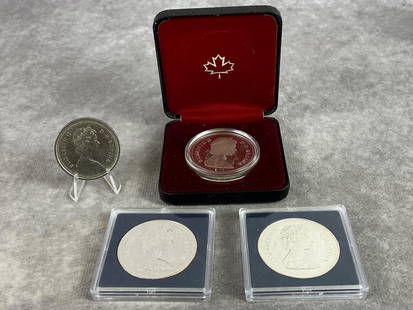 Canadian Commemorative Silver Dollars: Lot of four Canadian Commemorative Silver Dollars. Three uncirculated and one circulated. 50 percent silver. Weight in protectors 3.71 ozt.
