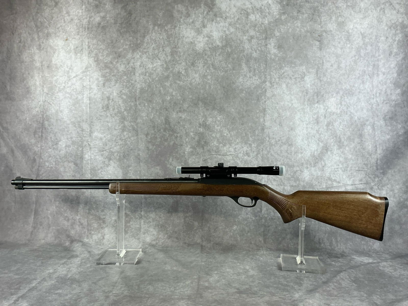 Glenfield Model 60 22LR Rifle: Serial number 72315056. Glenfield model 60, 22LR. Produced in 1972. In good condition, minimal patina and the stock is in good condition. Includes Glenfield scope. Barrel measures 22inches, gun measur
