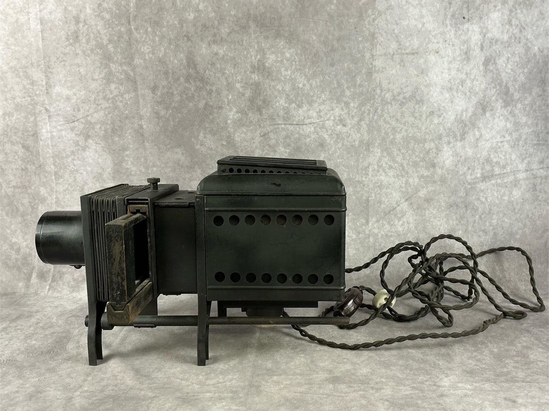 Bausch & Lomb Magic Lantern Projector: Antique Bausch & Lomb Optical Co. Model B Balopticon projector. No. 42030 with a patent date of Feb 21, 1911. Bellows are in good condition. Includes bulb, untested as cord is frayed heavily at the pl
