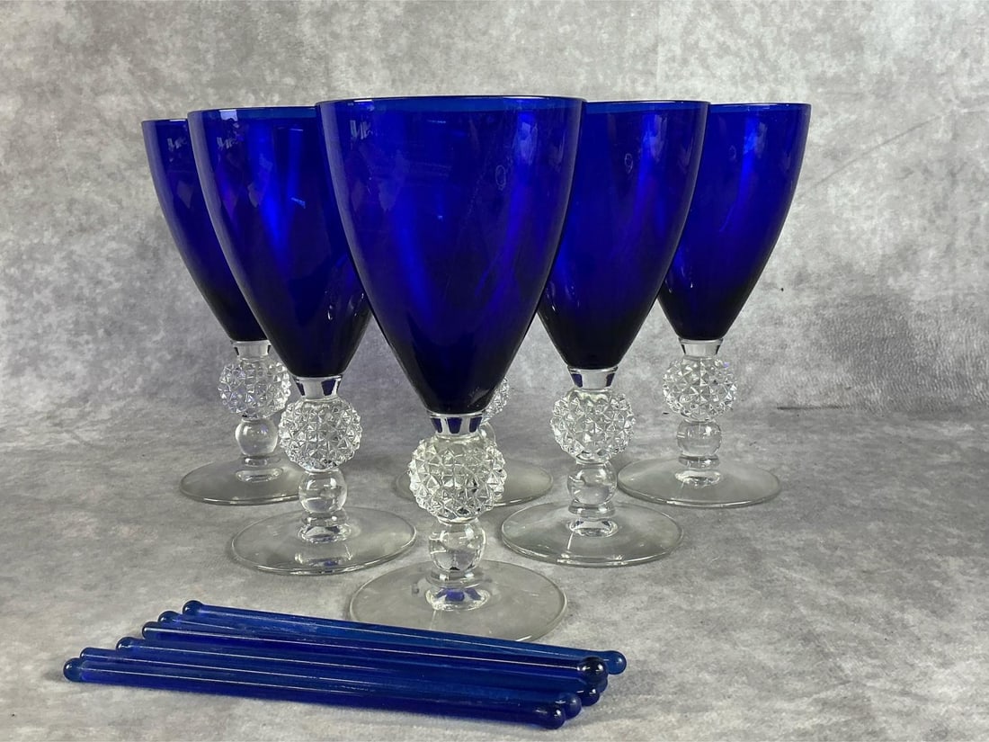 Morgantown Golf Ball Cobalt Glasses: Six ritz blue claret wine glasses with six cocktail stirrers. Good condition. Measures 3.5 inches in diameter x 6.75 inches tall.
