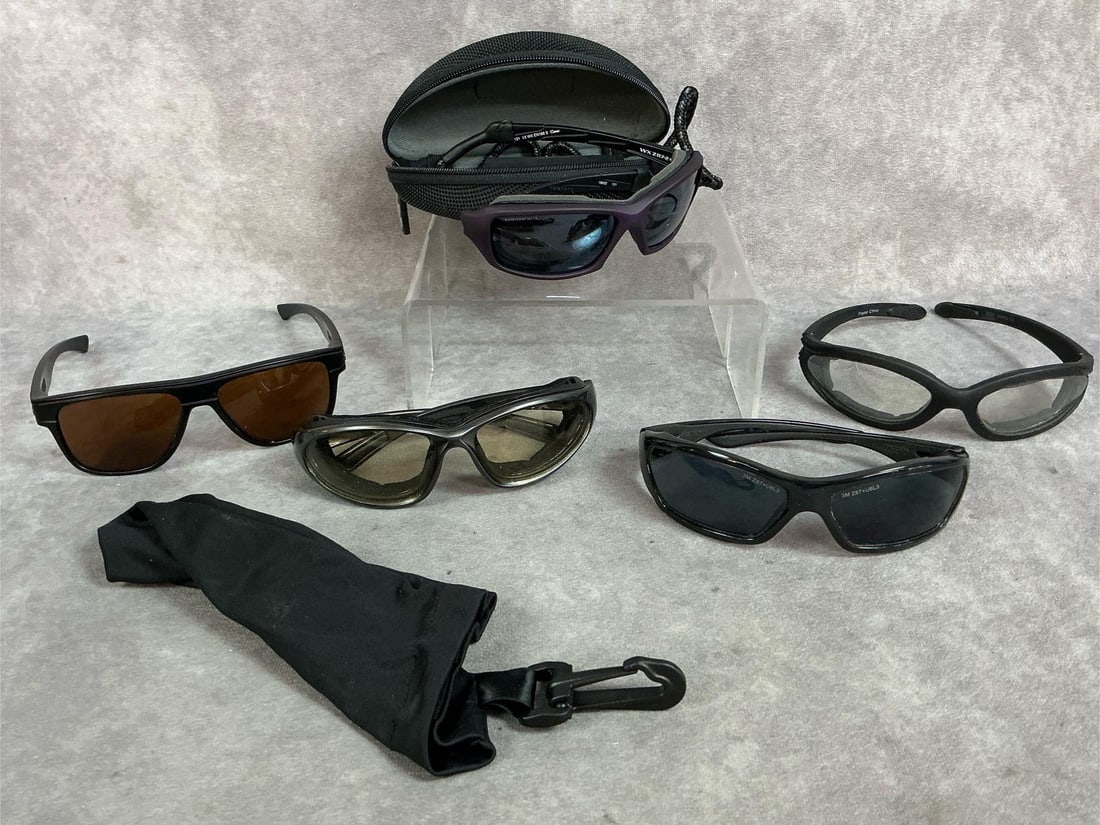 Driving Glasses: Five pair of modern motorcycle sun glasses. Tinted plastic frames with three cushioned pair. Brands include 3M, Wileyx, and Oakley. In fair to good condition.