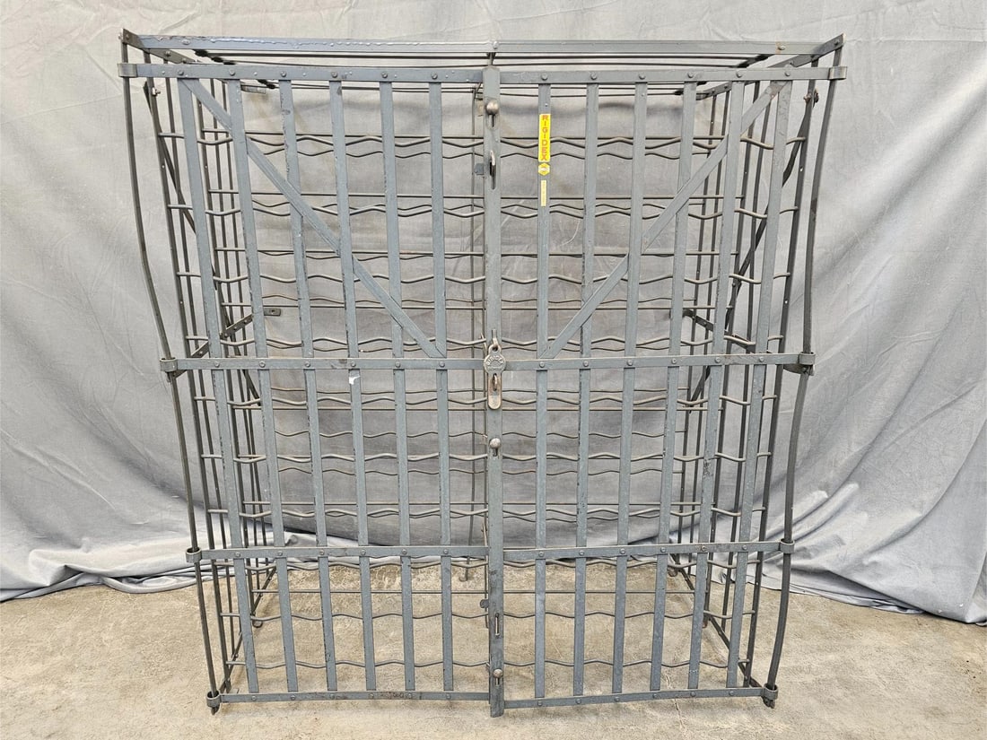 Rigidex Wine Cage: Modern metal wine cage made by Rigidex in France. Holds 200 bottles of wine. Shows signs of wear to paint of metal frame, otherwise good condition. Measures 39.25 inches wide x 22.25 x 45 25 inches ta