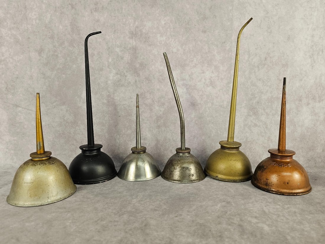Eagle Brand Oilers: Four vintage Eagle brand Oilers and two Gem Mfg. Brand Oilers. Some have rust or loss of finish. Bottoms are good on all. Largest measures 3.5 inches in diameter at base x 10.5 inches tall.