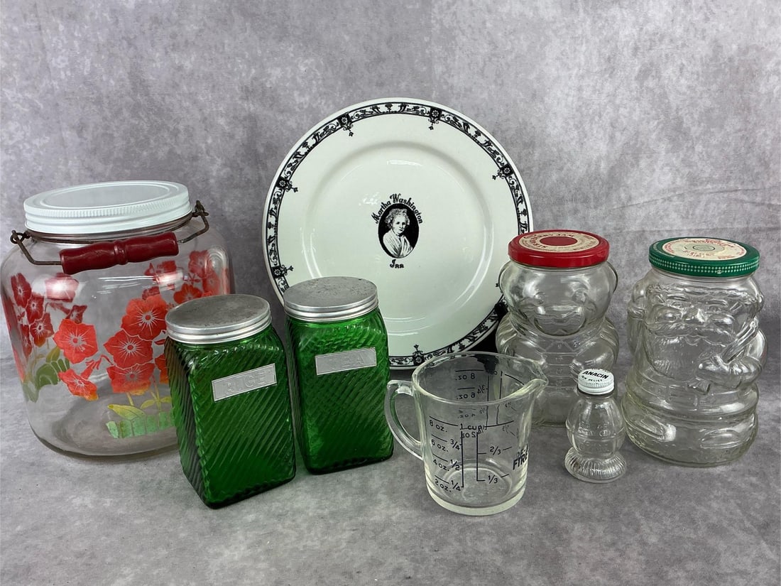 Mid Century Kitchen Collectibles: Eight mid century kitchen pieces. Martha Washington dinner plate by McNicol. Two Kraft jam jars molded into a bear and Santa. Gallon glass jar with wood bail handle and lid. Two Owen’s Illinois gree