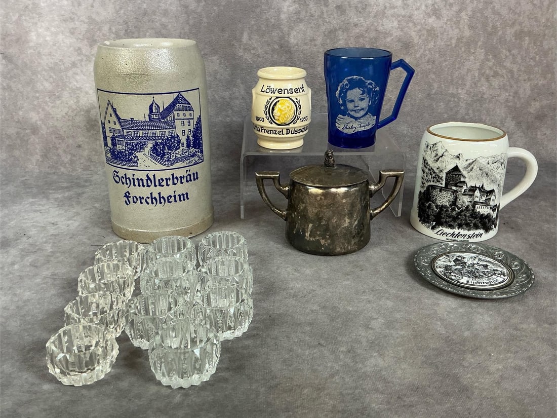 German Mugs, Ritz Carlton Sugar Bowl & More: Six collectible pieces and eleven salt cellars all from early to mid 1900s. Schindlerbrau Forcheim stoneware beer mug, Schloss Vaduz Liechtenstein castle mug and coaster, and Lowensenf mustard pot. In