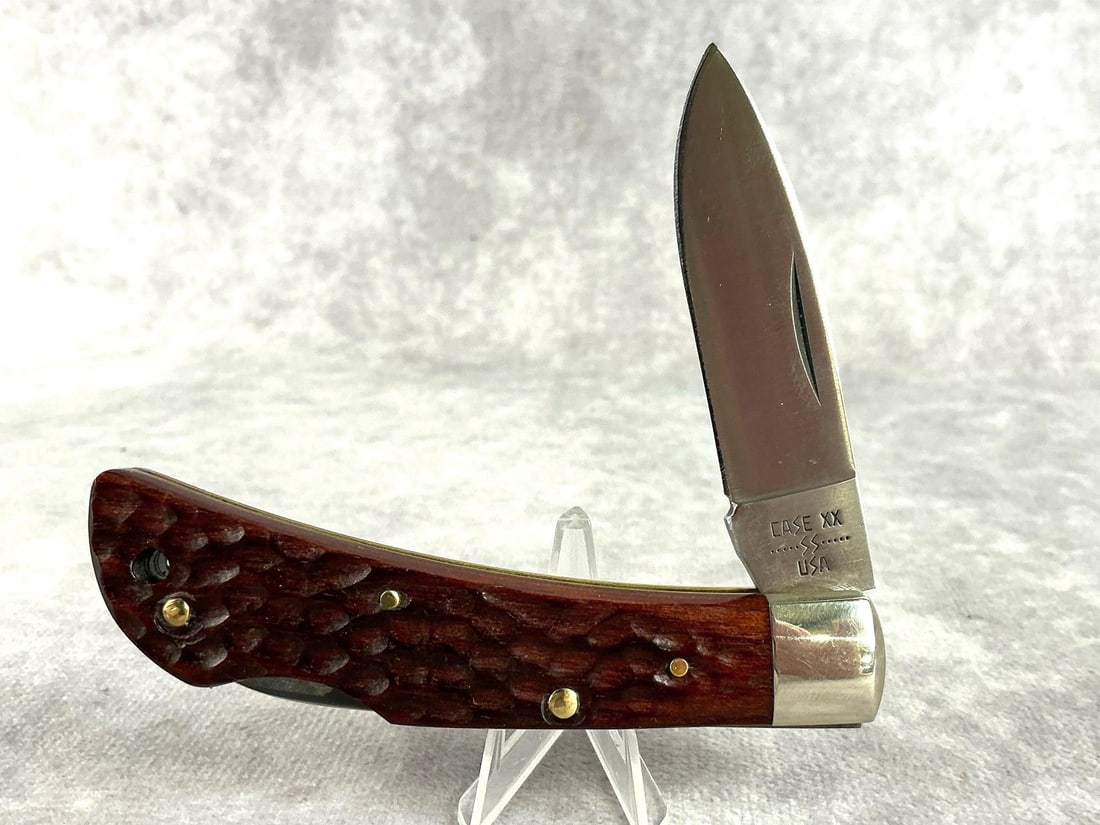 1977 Case XX Wooden Lockback Knife: 61051 LSSP Lockback Knife with wood handles. Nickel bolsters. Never carried or sharpened. Tight snap. Measures 4 inches closed.