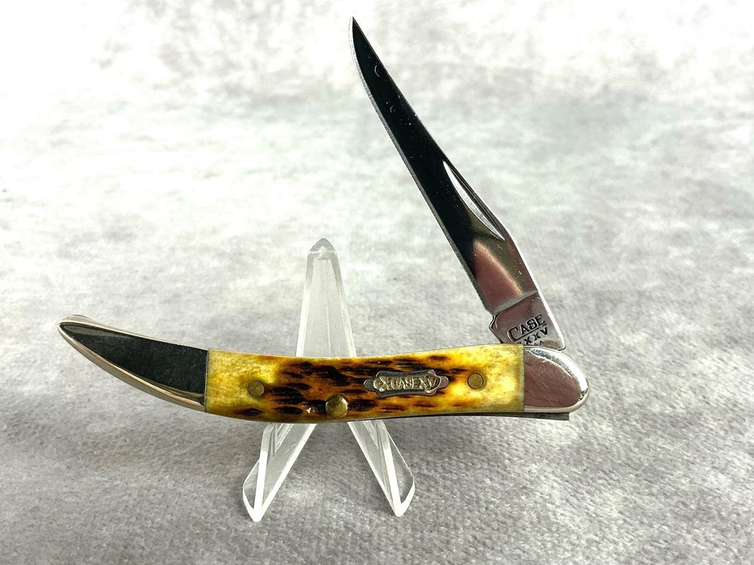 Case XX Small Toothpick Knife: No. 610096 small toothpick knife, with sunburst bone handle. Never carried or sharpened, tight snap. Includes box. Knife measures 3.25 inches long, closed.