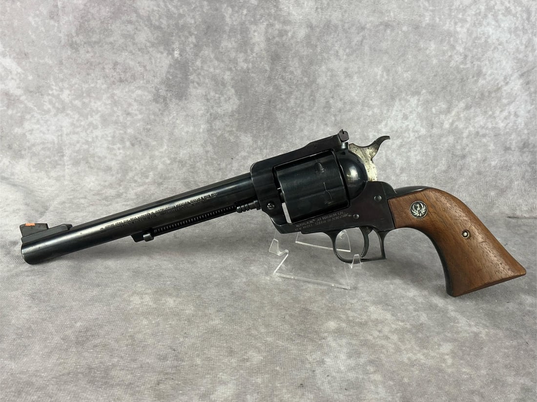 Ruger Super Blackhawk Eagle Revolver: Serial No. 82-74893. Ruger Superblack Eagle 44 magnum revolver. Rust present to hammer. Bore and cylinder are in good condition. Some pitting to the outside of the barrel. Original grips. Barrel measu