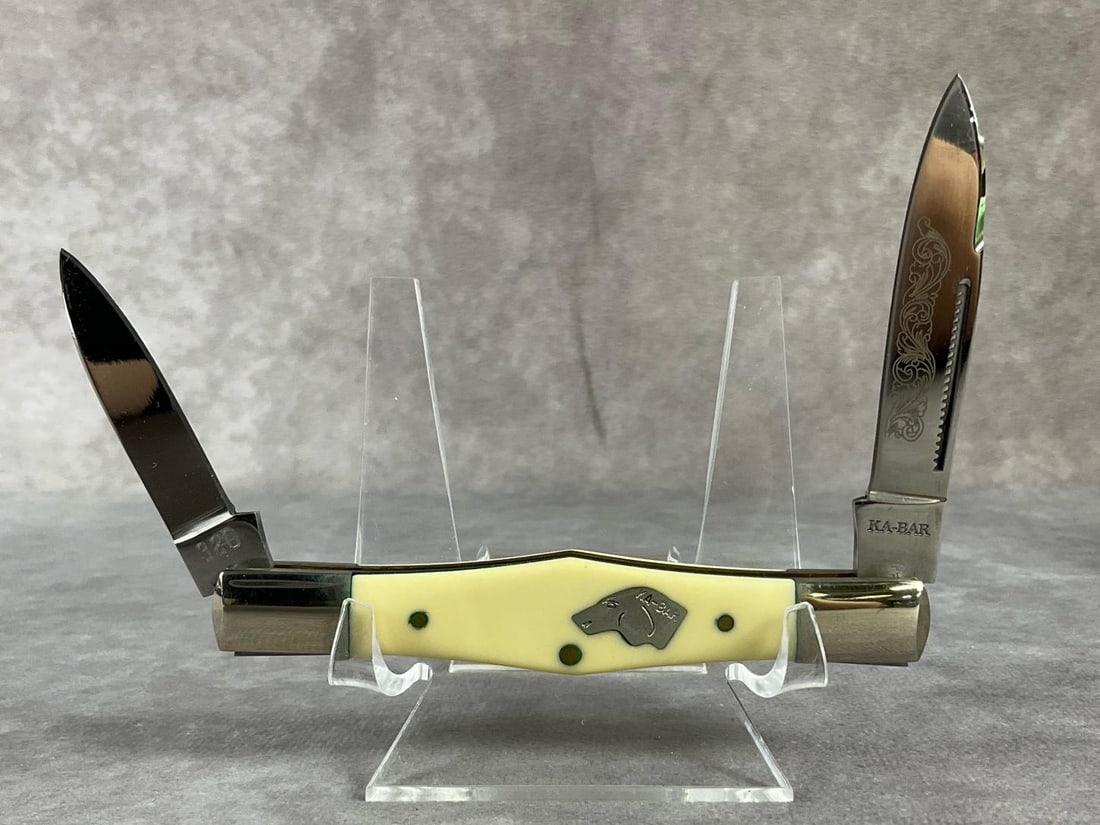 KaBar Swell Center Knife: CBS91 320. KA-BAR swell knife. Oxidation on the bolster pins, streaks on blades, scuffs to bolsters, overall good condition. Comes with box. Never sharpened, tight snap. Measures 4 inches closed.