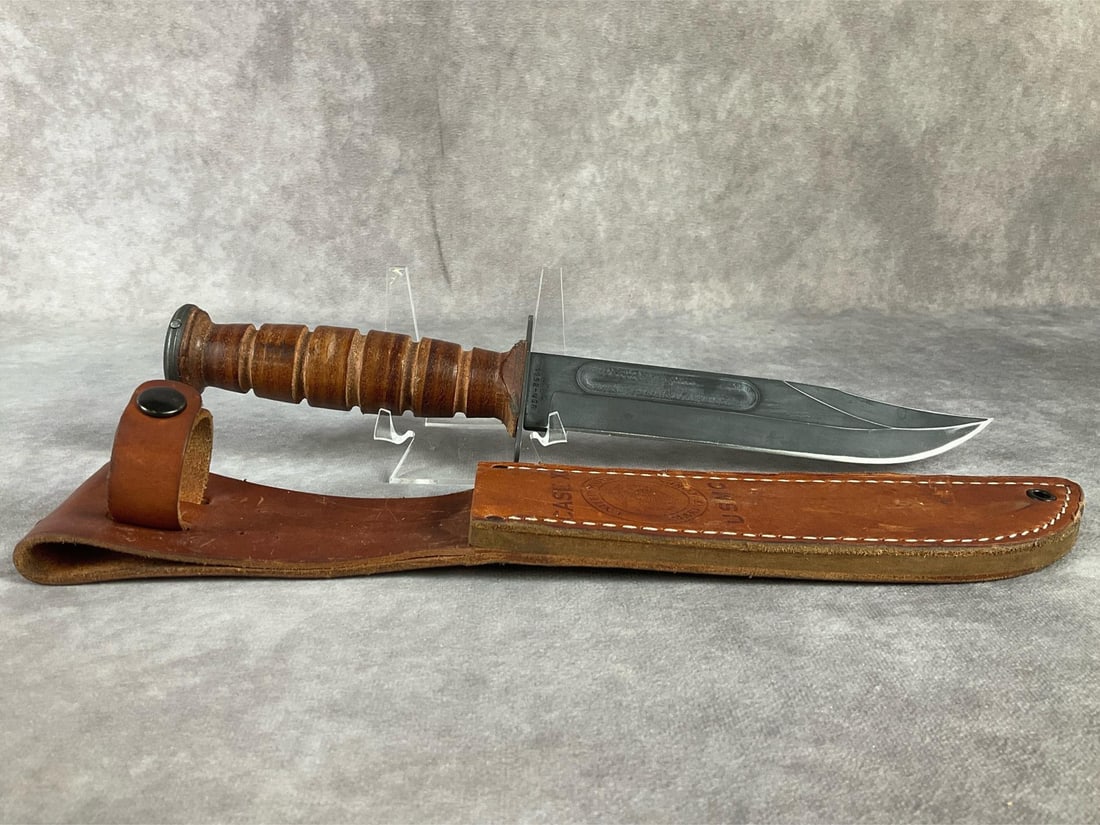 Case USMC Combat Knife: 1999 Case XX dagger combat knife with USMC sheath. Minor pitting to blade, overall good condition. Sheath has wear. Knife measures 12.25 inches long.