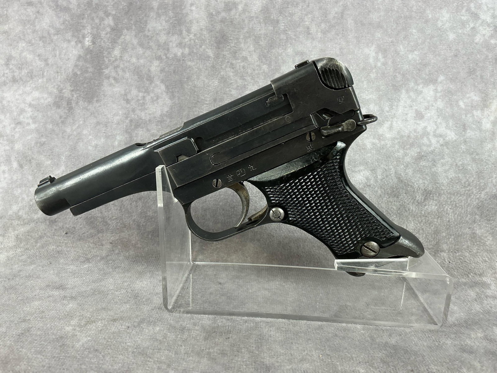 Japanese Type 94 8mm Nambu Pistol: Serial No. 20038. Japanese WWII Type 94, 8mm with original holster. Notes from the seller state that the magazine does not match. Finish is in fair to good condition. The bore is in good condition. Ba