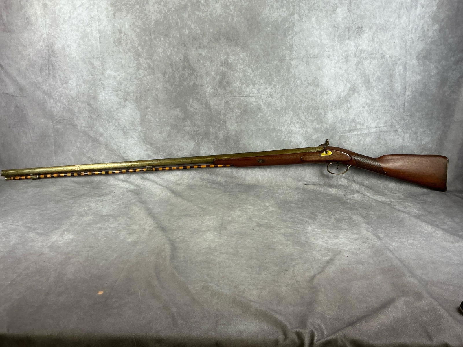 Goulcher Black Powder Percussion Rifle: No Identifiable Serial No. Goulcher Black Powder Percussion Rifle. No indentifiable markings of caliber or model number. All mechanisms work correctly. All metal components are covered with varnish. W