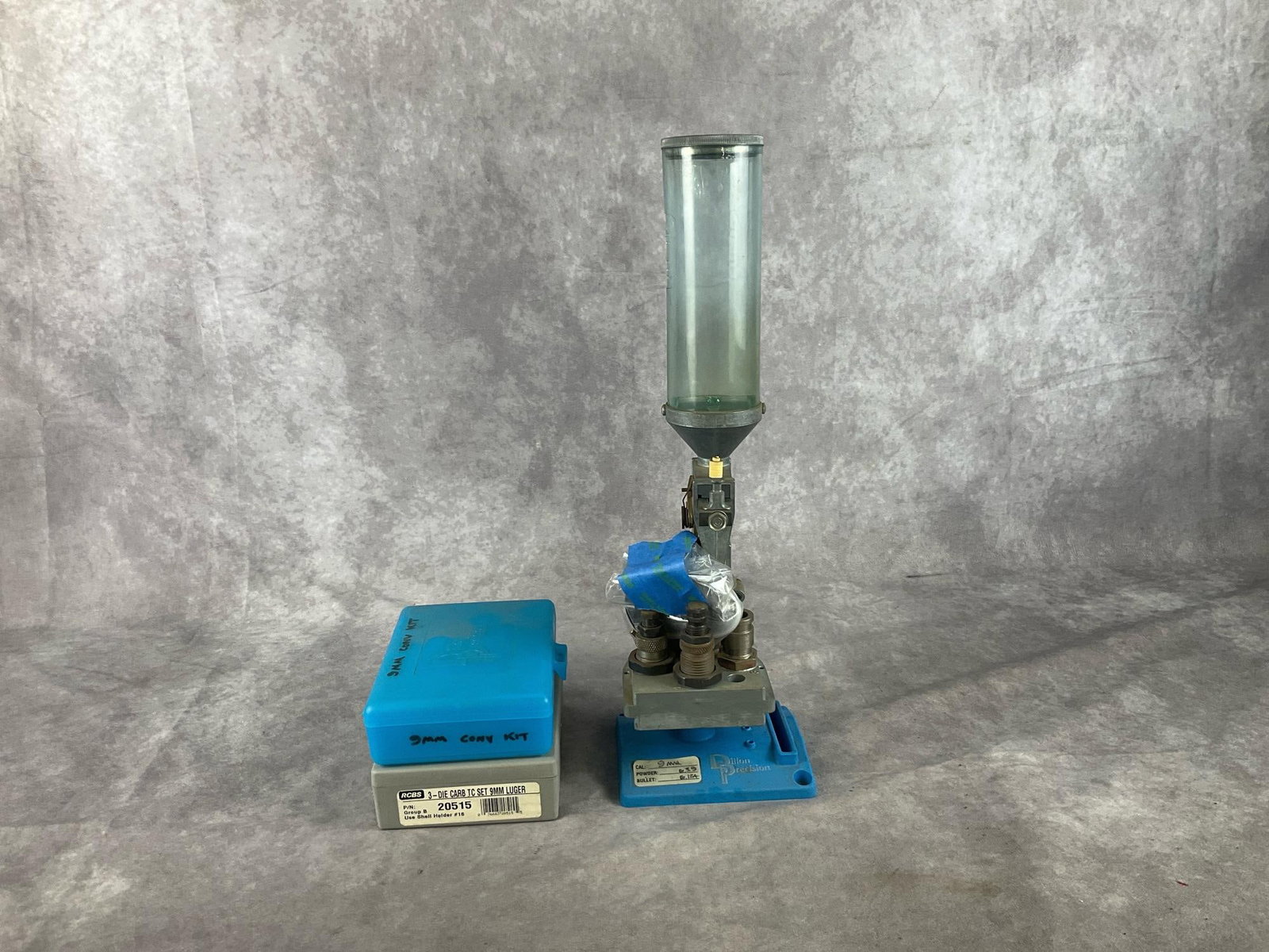 Dillon Reloading Toolhead with Stand: Dillon Reloading Toolhead and Stand set with 9mm Luger Dies, Conversion Kit included. Used in good condition. Measures 5 inches wide X 4.5 X 16 inches tall.