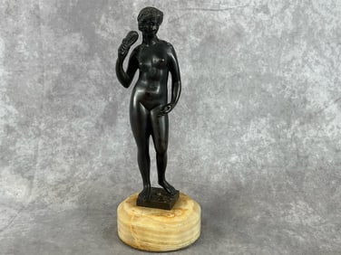 Art deco bronze figure of a nude lady on an alabaster base. Base has felt on the bottom. Good