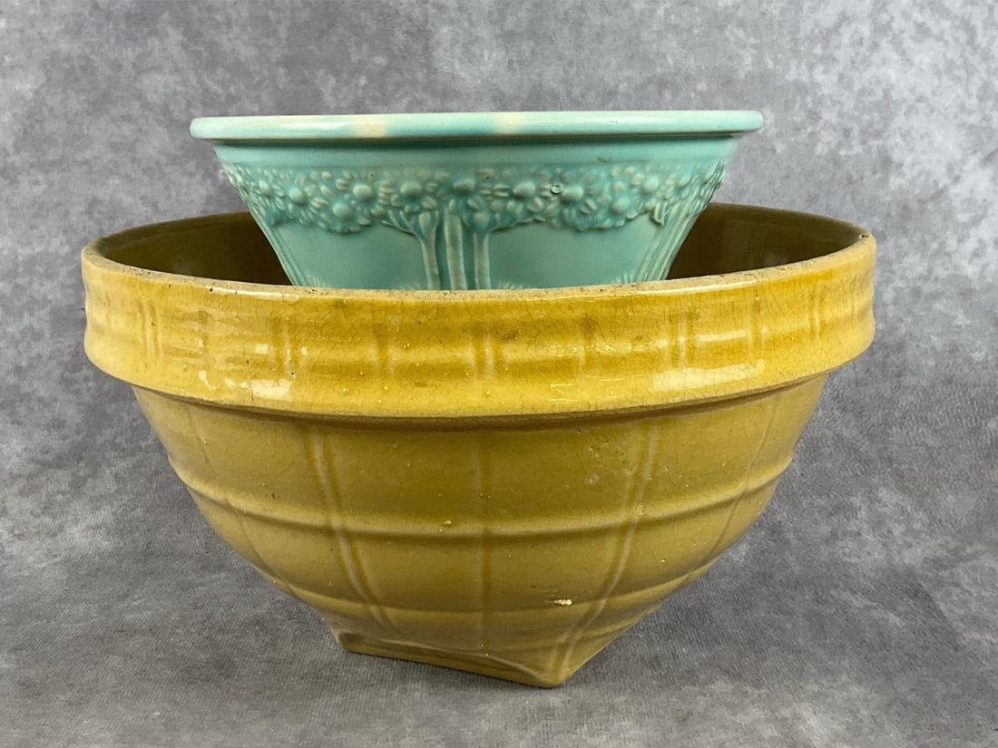 One Homer Laughlin Apple Tree small bowl, and one McCoy yellow Windowpane large bowl. Both have: One Homer Laughlin Apple Tree small bowl, and one McCoy yellow Windowpane large bowl. Both have crazing present. Largest bowl measures 8.5 inches in diameter x 5.5 inches tall.