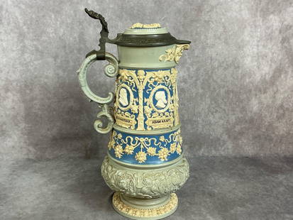Early 1900s pottery stein. Pitcher like stein by Villeroy and Boch with cameo relief pictures of: Early 1900s pottery stein. Pitcher like stein by Villeroy and Boch with cameo relief pictures of Nuremberg Artists. Mold