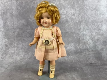Composition doll from the 1930s. Made from a sawdust-based, wood-pulp material and featured
