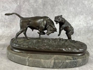Mid 20th century copy of French bronze casting on marble base. Figure shows a bear fighting a bull.