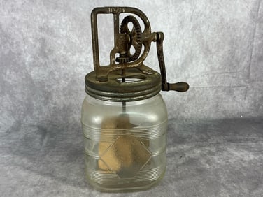1920's Dazey butter churn with wooden paddle and handle. Some expected loss of tin coating otherwise