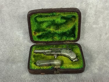 Late 1800s miniature pinfire pistol with hexagonal breach-loading barrel, two piece decorated pistol