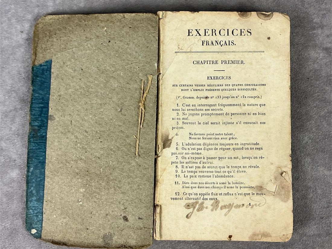 Circa 1840 "Exercices Francais" book found on dead school girl after the eruption of Mt. Pelee in: Circa 1840 "Exercices Francais" book found on dead school girl after the eruption of Mt. Pelee in 1902 in St. Pierre, Martinique. Lot contains vial of volcanic dust and two related papers including a 