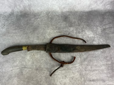 Early 1900's Indian tiger knife. Leather scabbard with tooled design. Illegible script at top of