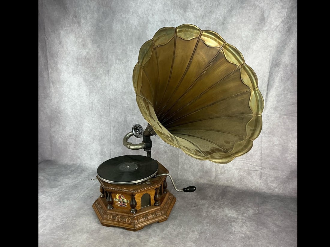 Early 19th century Parlophone victrola. Appears to be playable, cranks and turntable rotates.: Vintage reproduction Parlophone gramophone. Appears to be playable, cranks and turntable rotates. Probably needs a new needle. Good overall condition. Measurement 27 inches overall height . Victrola 7