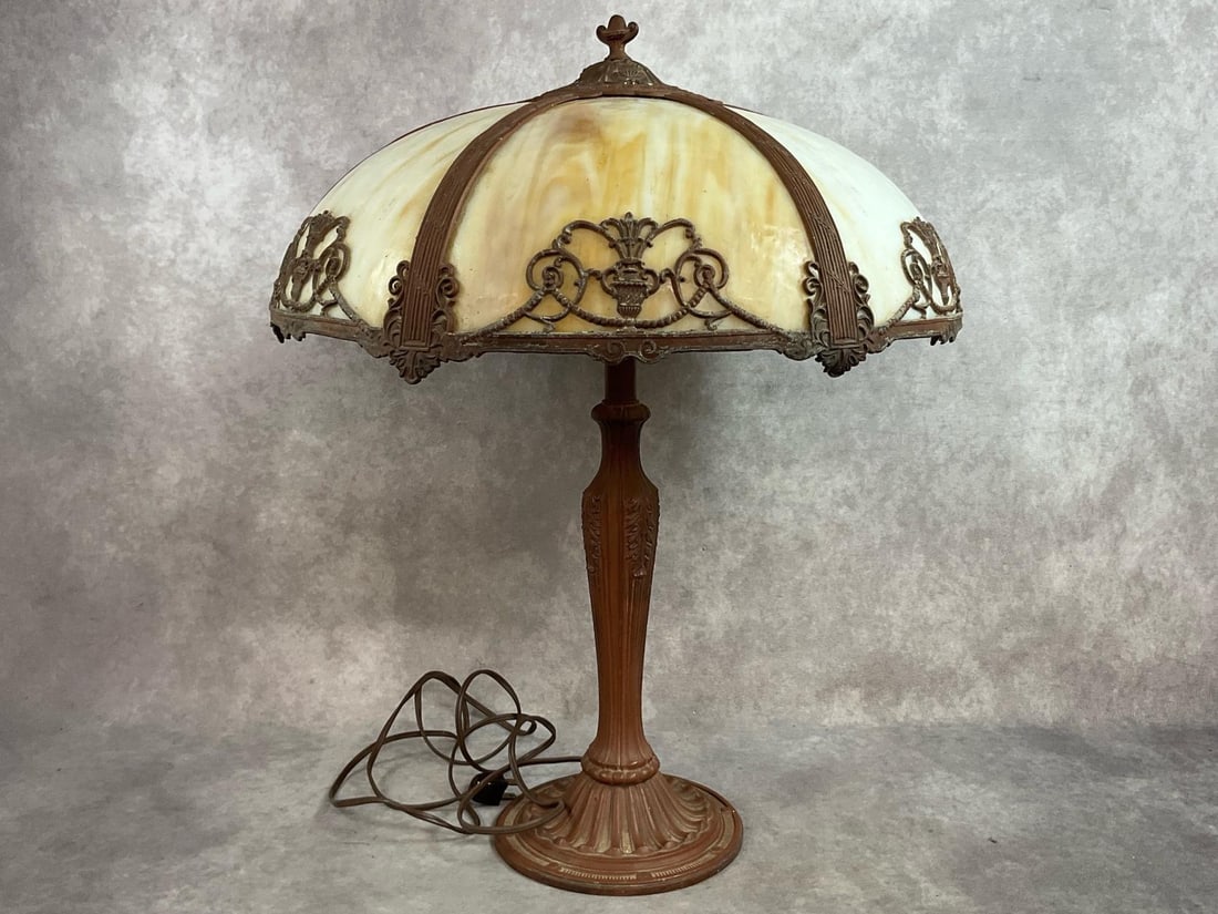 1930s Carmel slag glass six panel lamp with painted cast metal base. Glass panels are in good: 1930s Carmel slag glass six panel lamp with painted cast metal base. Glass panels are in good condition, heavy patina to overlay on shade and one crack in metal on top of shade. Wear to paint on base.
