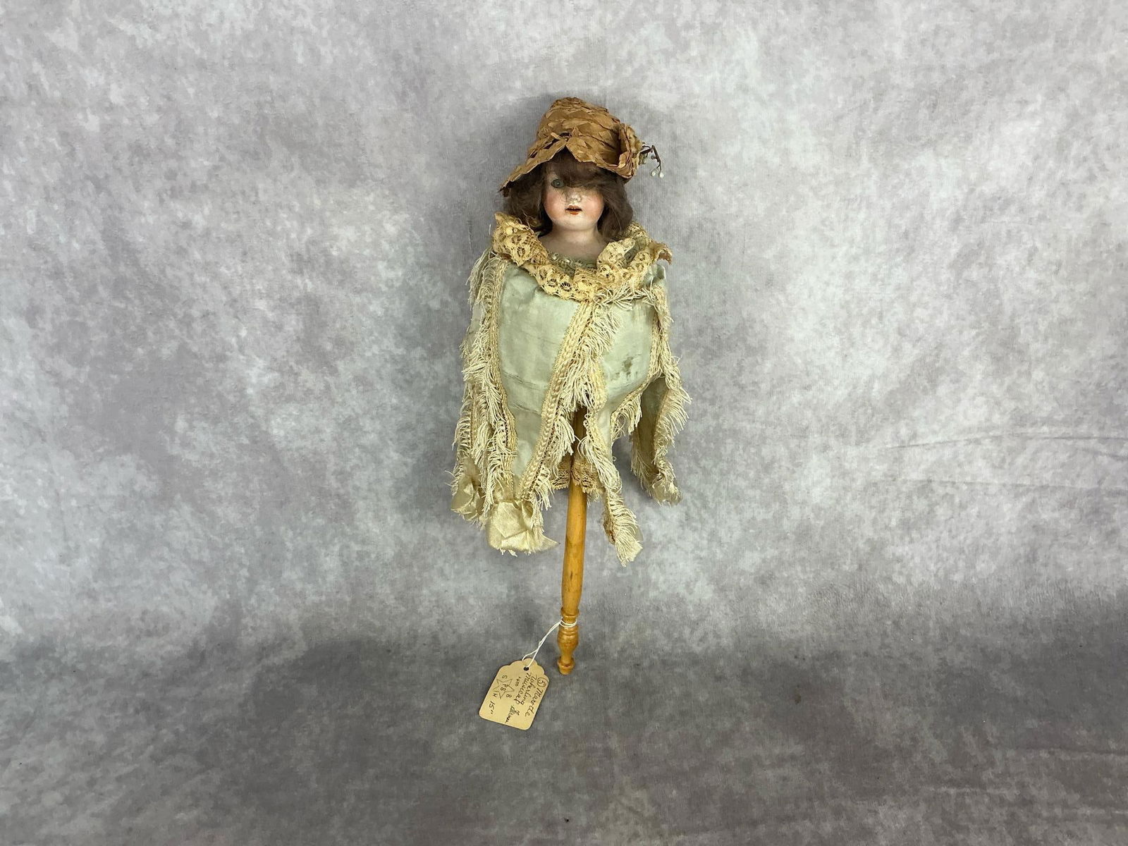 Circa 1900 musical Marotte doll from the Simon and Halbig firm Germany. Marked on back of doll's: Circa 1900 musical Marotte doll from the Simon and Halbig firm Germany. Marked on back of doll's neck. Biscuit head. Some wear on the silk and linen garments. Several holes in the straw hat. Does not