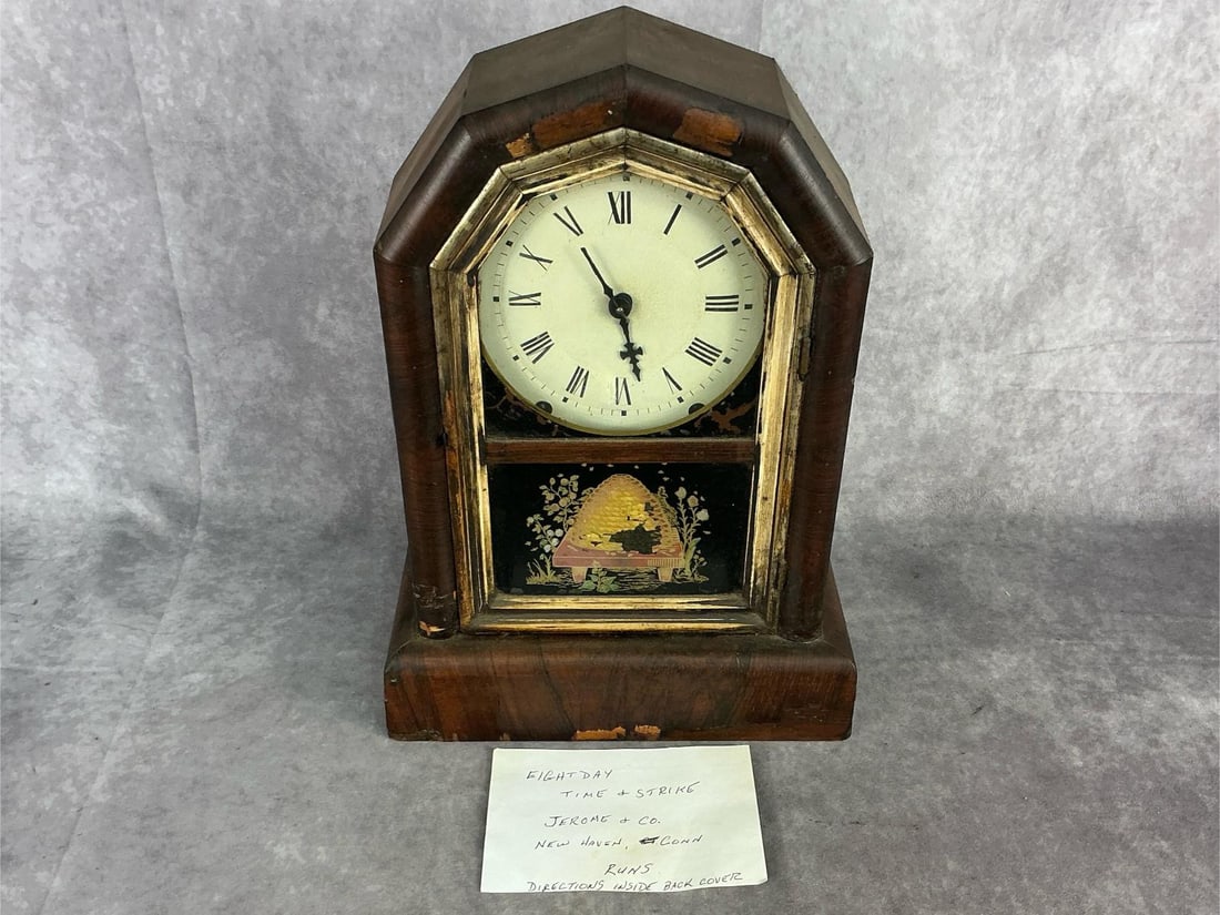 Late 19th century eight day Jerome & Co. mantel clock New Haven, Connecticut. Running condition.: Late 19th century eight day Jerome & Co. mantel clock New Haven, Connecticut. Running condition. Some loss to reverse painting and veneer. Measures 11 inches wide x 4.75 x 15.5 tall.