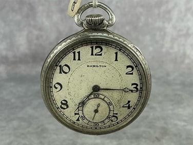 Circa 1930 Art Deco Hamilton marked 14k / 17 jewels pocket watch. Dial with some discoloration. Runs