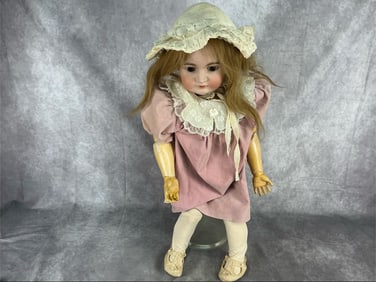 Early 20th century German Bisque head and composition body child doll possibly made by Simon and