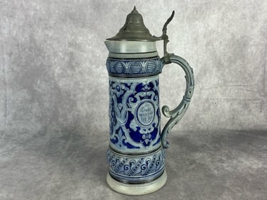 Early 20th century two liter salt glazed cobalt beer stein with pewter lid and thumb piece.