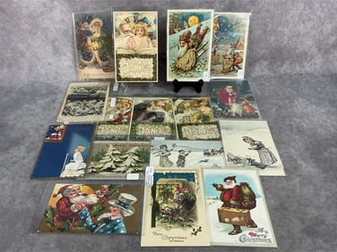 Sixteen early 1900s Christmas and New Year postcards. Includes Santa and Uncle Sam, purple robe