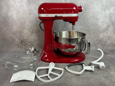 Brand new red KitchenAid Professional 600 mixer with the whisk, paddle, dough hook, flex edge