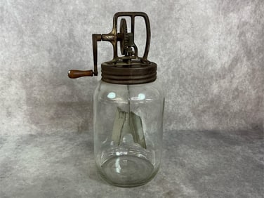 1920s butter churn. Dazey number 80 glass hand crank churn. Rust present. Measures 5.5 inches in