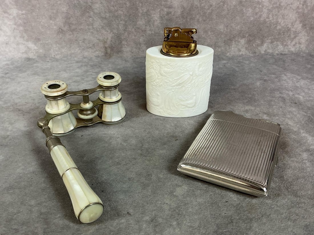 Early to mid 1900s collectibles. German Rosenthal Studio Linie Lighter with textured designs. Opera: Early to mid 1900s collectibles. German Rosenthal Studio Linie Lighter with textured designs. Opera glasses fold and have mother of pearl body. Evan's silver tone cigarette case with lighter on top. L