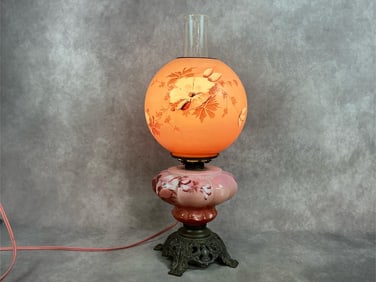 Early 1900s electric Gone with the Wind hurricane style lamp with floral design on pink glass base.