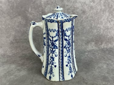 Late 1800s flow pot. England's Ridgeway porcelain blue and white with gold flecks pitcher. Menai