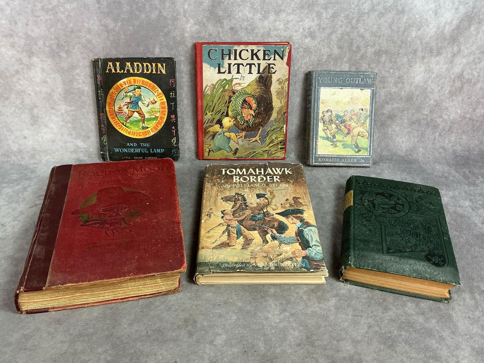 Six early to mid 1900s books. Includes Chicken Little, Rogue Moon, Peter the Whaler and more. Books: Six early to mid 1900s books. Includes Chicken Little, Rogue Moon, Peter the Whaler and more. Books have foxing, loose pages and worn covers. In fair to good condition. Rogue Moon measures 7.25 inches