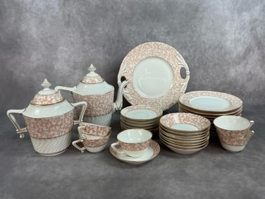 Thirty three pieces from early 1900s porcelain. Limoges tea set, dessert plates, small bowls,