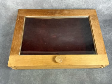 Modern display case. Light wood with glass case. Made to lay flat or stand up, with cabinet latch.