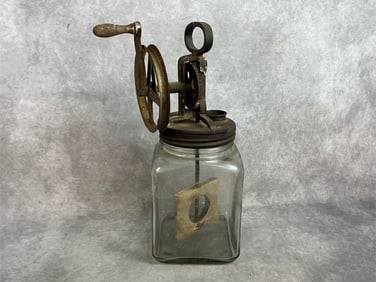 Early 1900s butter churn. Metal hand crank and heavy glass base Dazey churn. Metal is rusted. In