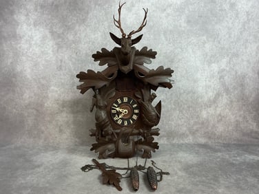 Mid 1900s clock. Black Forest deer head and hunter cuckoo clock. Pendulum and weights included.
