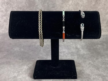 Two bracelets and one rope chain necklace. All in good condition, stamped and acid tested. 0.99 ozt,