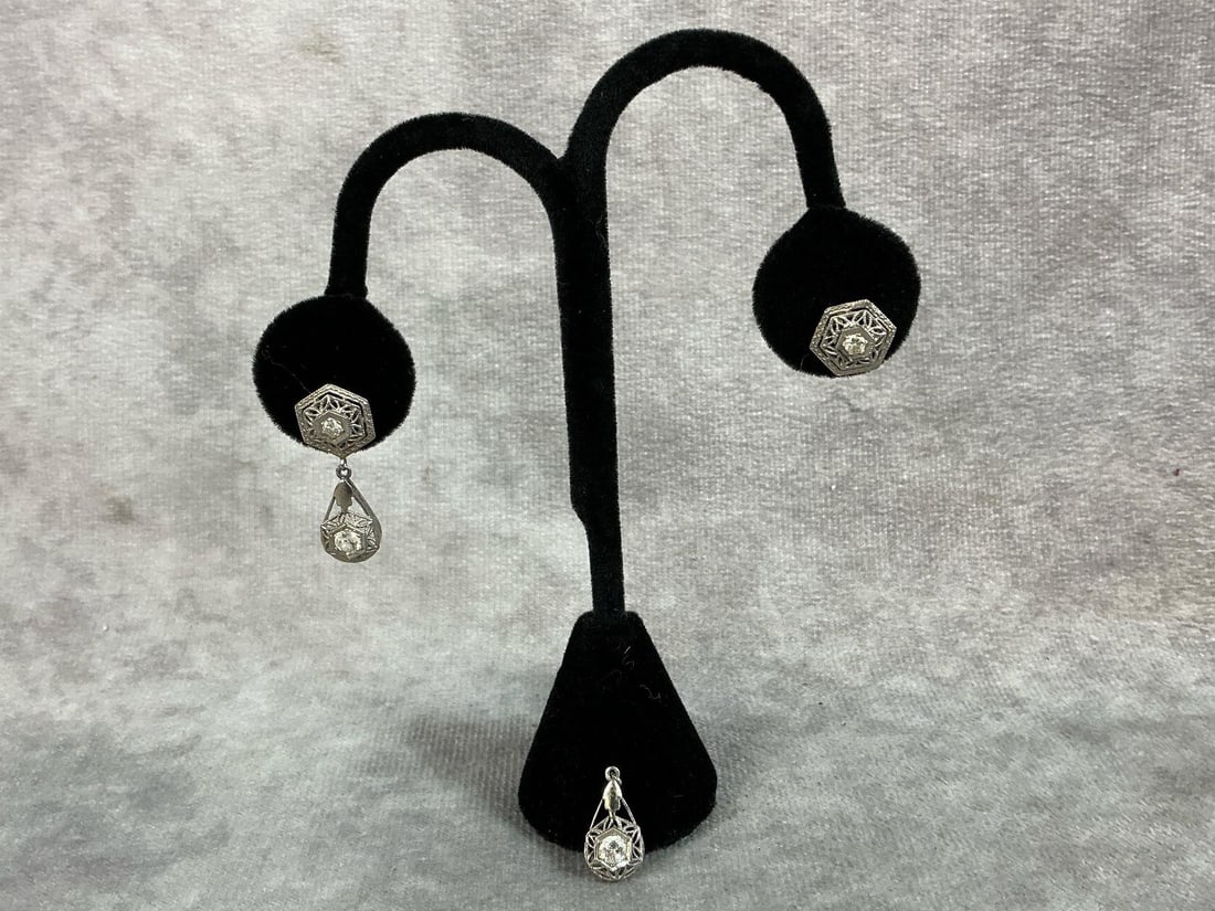 Pair of 14kt white gold filigree Art Deco period earrings with diamonds. Each earring has two: Pair of 14kt white gold filigree Art Deco period earrings with diamonds. Each earring has two diamonds. One earring is broken. Earrings are not marked but held to 14kt test. Total weight is 1.8 dwt.